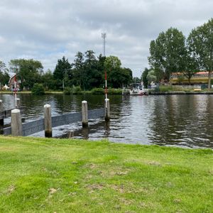 A ferry in the distance on a river