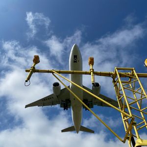 A picture of a landing aeroplane from underneath